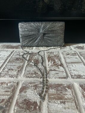 Marshalls Silver Glitter Knot Clutch with Chain